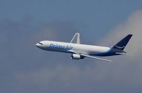 amazon unveils cargo plane as it