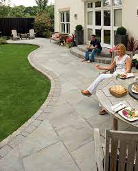 For the keen gardener, using circular patio slabs as a base or centre point for a striking tree in the middle and finally to finish the look, a small round patio can look great when edged with something. Indian Sandstone Paving Indian Stone Paving Marshalls Patio Garden Design Outdoor Gardens Design Backyard Landscaping Designs