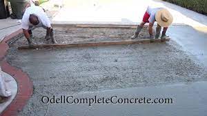Bricks are laid in a narrow trench around the edge of a patio, which can also be made of brick, concrete, pavers, or other materials. How To Pour A Concrete Patio With A Brick Ribbon Pattern Youtube