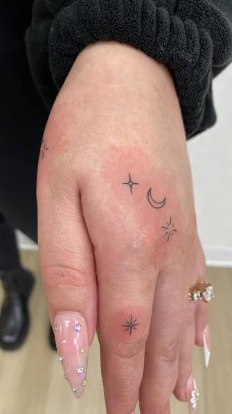 The stars and moon rest on her daughter's small fingertips. This has been the most heartwarming tattoo I've worked on., ., ., ., #finelinetattoo #handtattoos #daintytattoo #sacramentotattooartist ...
