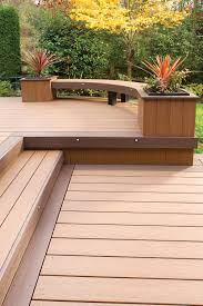 Azek Arbor Collection Decking In Acacia With Kona Accents Check Out The Curved Bench Timber Deck Building A Deck Deck Design