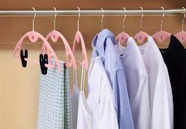 Human shoulders designed to facilitate the hanging of a coat, jacket, sweater, shirt, blouse or dress in a manner that prevents wrinkles, with a lower bar for the hanging of trousers or skirts.; The Best Velvet Hangers For Space Saving In Your Closet Bob Vila