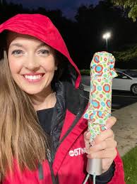 Jacket on, hood up, umbrella