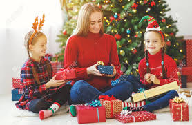 Whether you're searching for a stocking filler or secret santa gift, buying a christmas hamper for a. Happy Family Mother And Children Open Presents On Christmas Stock Photo Picture And Royalty Free Image Image 111797714