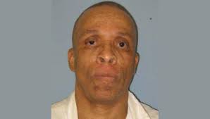 Man serving life for deadly stabbing at a barbecue dies in Alabama prison