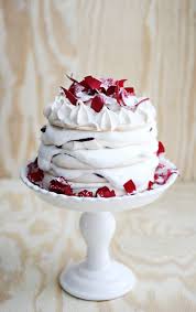 Fill the center of the meringue with whipped cream, and top with kiwifruit slices. Pavlova Rose Water Whipped Cream A Beautiful Mess
