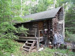 This hunting cabin is complete and ready to stay in featuring a huge 12 ft covered front porch, comes with stove , fridge, washer and dryer. Lake George Real Estate Log Cabin For Sale