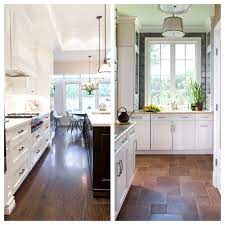 Lots of white paint and warm wood gave the space vintage style. Poll Wood Floors In The Kitchen