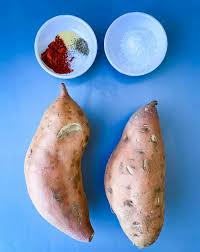 Next, spread the seasoned wedges out on a lined or greased baking sheet so they're in an even layer. Easy Air Fryer Crispy Crunchy Sweet Potato Fries