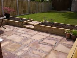 Landscaping In Chesterfield Includes Indian Stone Patio Hit N Miss Fencing Turf Chesterfield Fencing In 2020 Sloped Garden Patio Garden Design Back Garden Design
