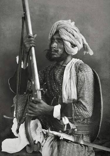 Circa early 1860's. India, Delhi. 'Rajpoots.' 'The group photograph shows a party of Chohan soldiers armed in the native manner. The figure on the right has a broad shield at his back,