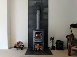 A Blue Charnwood C 6 Wood Stove With A Contemporary Fireplace Consisting Of A Natura In 2020 Wood Stove Fireplace Wood Burner Fireplace Wood Burning Stoves Living Room
