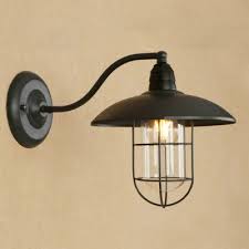 For a bold design choice in your backyard or around your home, consider embracing the nautical theme and taking it a step further. Industrial Nautical Wall Sconce With Glass Shade And Metal Cage Takeluckhome Com