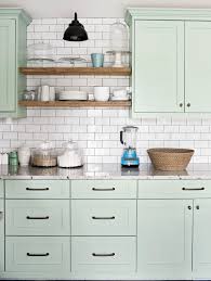 Perimeter counters are hawaiian green stone granite. How To Paint Laminate Cabinets For An Easy Kitchen Refresh Better Homes Gardens