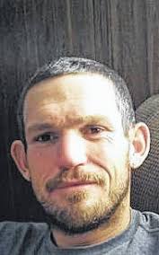 Four charged in double-murder