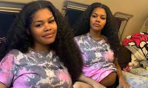 Curly crochet hair styles crochet braids hairstyles weave hairstyles curly hair styles natural hair styles teyana taylor kinky curly hair curly girl pharrell williams. Teyana Taylor Shows Bare Baby Bump In Tie Dye T Shirt While Aboard Plane For Late Night Flight Daily Mail Online