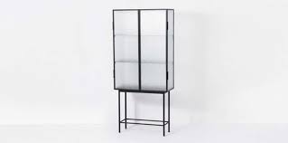Glass trophy cases show off hard work. 10 Easy Pieces Steel Framed Display Cabinets The Organized Home