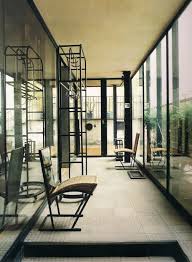A sofa whose back comes to an expressionist point, a bed that looks ready to float downstream, a table lacquered in a queasy green, and, my favorite, the la religieuse lamps, the nun's. La Maison De Verre Pierre Chareau Bernard Bijvoet Et Louis Dalbet Paris 1927 Architecture Architecture Landmark Classic Architecture