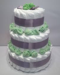 How To Make A Diaper Cake For Baby Shower How To Make Diaper Cakes With Decorating Tips Baby Shower Diapers Baby Shower Diaper Cake Baby Shower Crafts