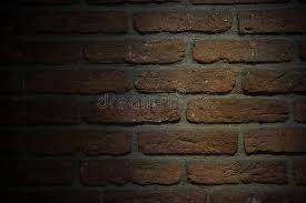 Brick wall background / old brown bricks wall pattern brick wall texture or brick wall background on day noon light for interior or exterior brick wall building and brick wall decoration texture. Brown Bricks Wall Background With Low Light Stock Image Image Of Material Bricks 126865841