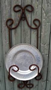 Wrought Iron Plate Rack Swivel hooks and black iron ceiling hooks are great for latching chandeliers. usd