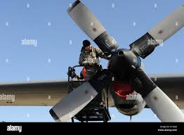 U.S. Army Staff Sgt. Manuel Salais, Iron Training Detachment Senior Air  Assault instructor and Cpl. Alexandra Perez, Iron Training Detachment Air  Assault instructor, perform inverted rappel techniques while U.S. Air Force  Master