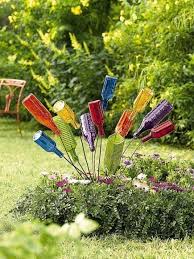 17 Fascinating Ways To Decorate Your Backyard Yard Art Crafts Garden Art Diy Glass Garden Art