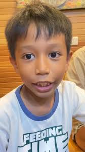 A young reader paused, turned each page with care—and then did something  unexpected. After reading the 2013 EDC Typhoon Yolanda Coffee Table Book,  displayed here at Alto Peak Chocolates, this child shared