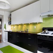 As this kitchen shows, going all black with the cabinets can still result in a surprisingly bright kitchen. Two Tone Cabinets Design Ideas Pictures Remodel And Decor Interior Design Kitchen Green Kitchen Designs Minimalist Kitchen