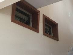 Vinyl is widely used for windows and patio doors for a good reason. Window Trim Beige Vinyl Windows With Wood Stained Trim