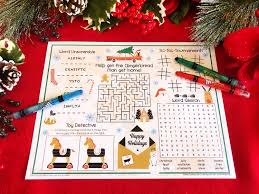 We lay down the wooden tablecloths over the cafeteria tables and put some natural looking garlands down the centers of the tables. Southern Mom Loves Christmas Games Placemat For Your Kids Table Free Printable
