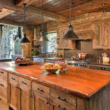 Not all log cabin kitchens are traditional. Pendent Lighting Over Island Lighting Is Nice But This Is Too Brown For Me Its The S Tuscan Kitchen Design Rustic Kitchen Lighting Rustic Kitchen Island