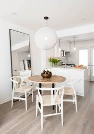 Open Floor Plan Dining Room With Circular Table And Circular Hanging Light Fixture Rtg Designs Apartment Dining Room Apartment Dining Apartment Living Room