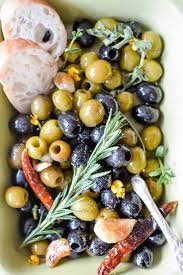 Spicy Marinated Olives With Roasted Garlic Herbs Recipe Olive Recipes Marinated Olives Roasted Garlic