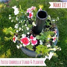 Create a shady spot for yourself in the garden by recreating this huge umbrella stand and grow plants in it as well. Diy Umbrella Stand And Planter