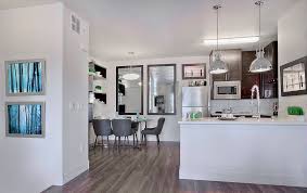 20 white kitchen cabinets with honey oak floors images. The Kitchens Have Wood Laminate Flooring Dark Wood Kitchen Cabinetry And Quartz Countertops Westcorp Management Group Las Vegas Review Journal