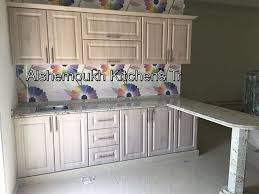 These Cabinets Are Lovely And That Marble Pillar Is Beautiful Kitchen Best Prices Showroom Sharjah Products Wood Cabinets Wardrobe Cabinets Kitchen