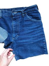 Use chalk or a safety pin to mark where on the jeans you plan to cut. A Foolproof Guide To Making Diy Cut Offs Racked
