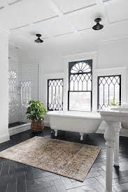 Kajaria ceramics' range of luxurious floor tiles integrates technological expertise with exquisite designs. White French Vintage Style Bathroom With Black Floor Tiles Transitional Bathroom
