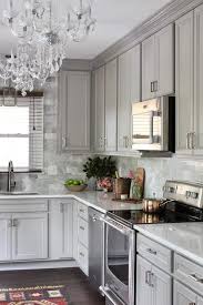 Nannette brown added american olean tiles to the ceiling, stove's backsplash, and a. Gray Kitchen With Gray Marble Backsplash Tiles Transitional Kitchen