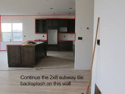 subway tile floor to ceiling in kitchen