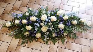 Both a funeral spray and a funeral wreath is a decorative arrangement of flowers that's displayed by the casket. Casket Sprays Petal Stem Florists Farnham