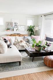 Brighten Up A Neutral White Living Room With Pops Of Accent Colors Through Throw Pillows And Living Room Design Modern Living Room Designs Living Room Seating