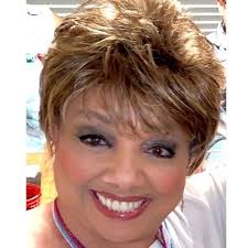 On her family's boat off the rugged coast of Maine, are my daughter and me.  People say we look alike. Really?