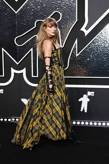 Taylor Swift has a history of collaborating with Dior for major career moments, like her viral 2024 VMAs look., AI generated