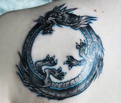 Twisted around itself into an almost heart shape. 35 Exceptional Ouroboros Tattoos Designs Webdesignlayer