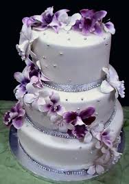 Maybe you would like to learn more about one of these? White Wedding Cakes With Purple Flowers Purple Wedding Cakes White Wedding Cakes Wedding Cake Purple Flowers