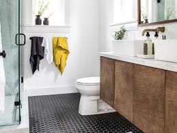 The stone vanity countertops play off the white marble tile flooring and mosaic tile backsplash, while brushed nickel fixtures provide a uniform look. The Best Flooring Options For Bathrooms This Old House