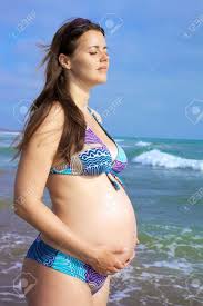 Beautiful Pregnant Female Model Relaxing In Front Of The Sea Stock Photo,  Picture and Royalty Free Image. Image 14461729.