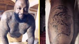 Rick ross stomach tattoos and belly tattoos. Rick Ross Went And Got Nipsey Hussle S Face Tattoo On His Leg Video Yardhype Com